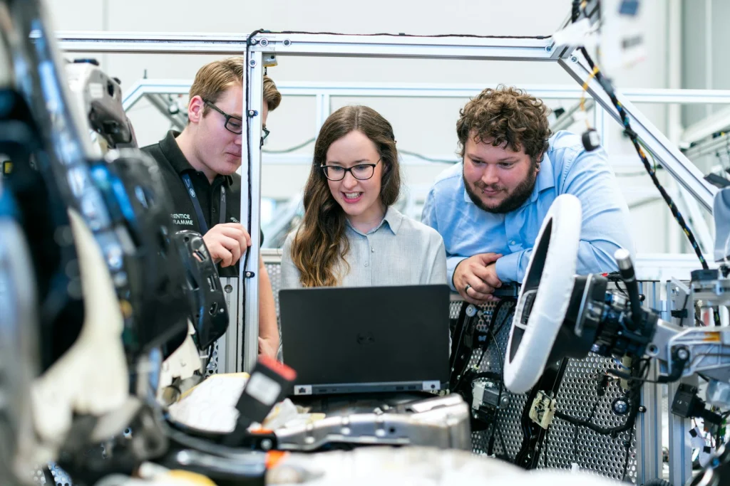 Engineer operating precision manufacturing equipment