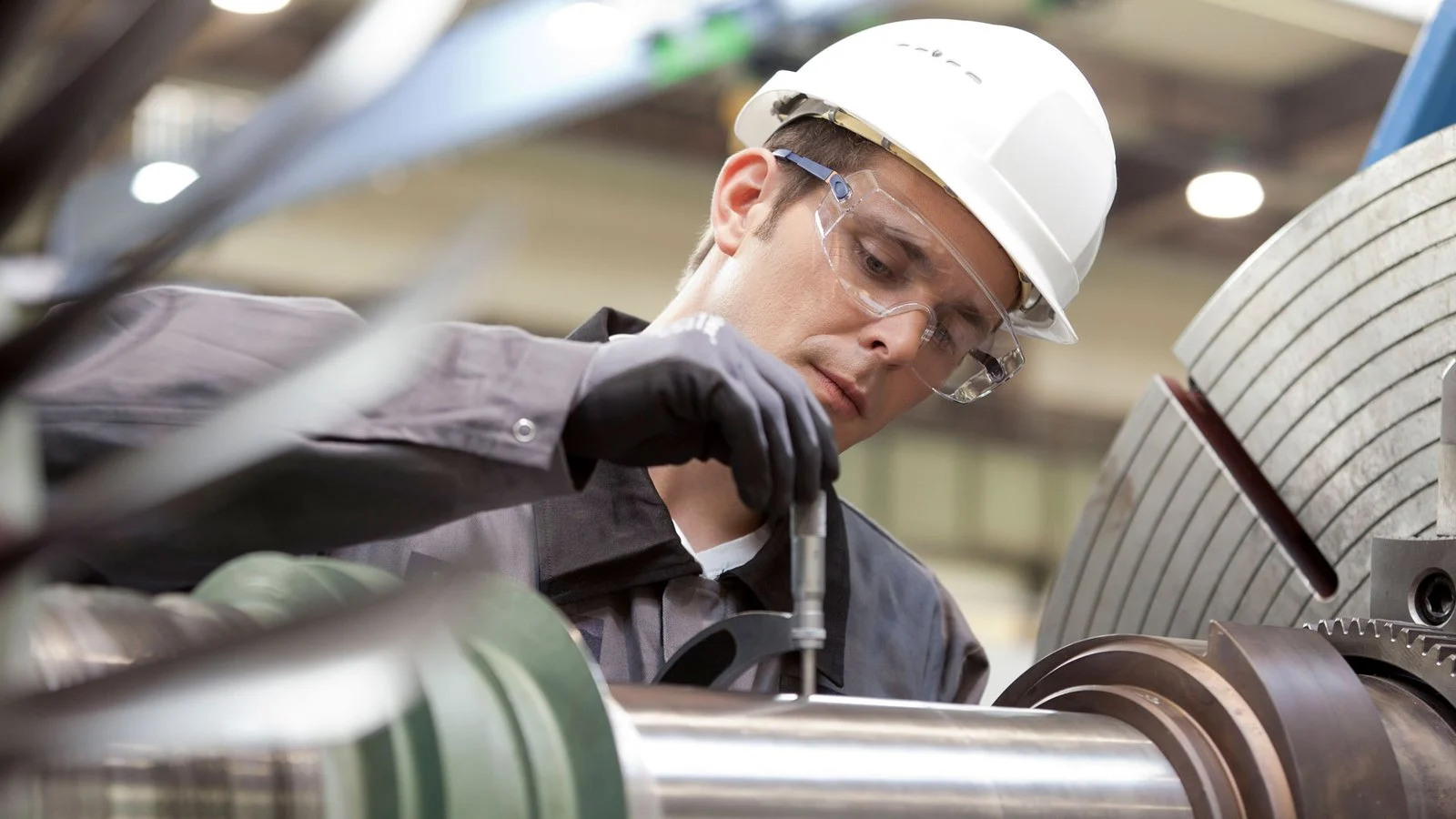 Field technician servicing industrial machinery