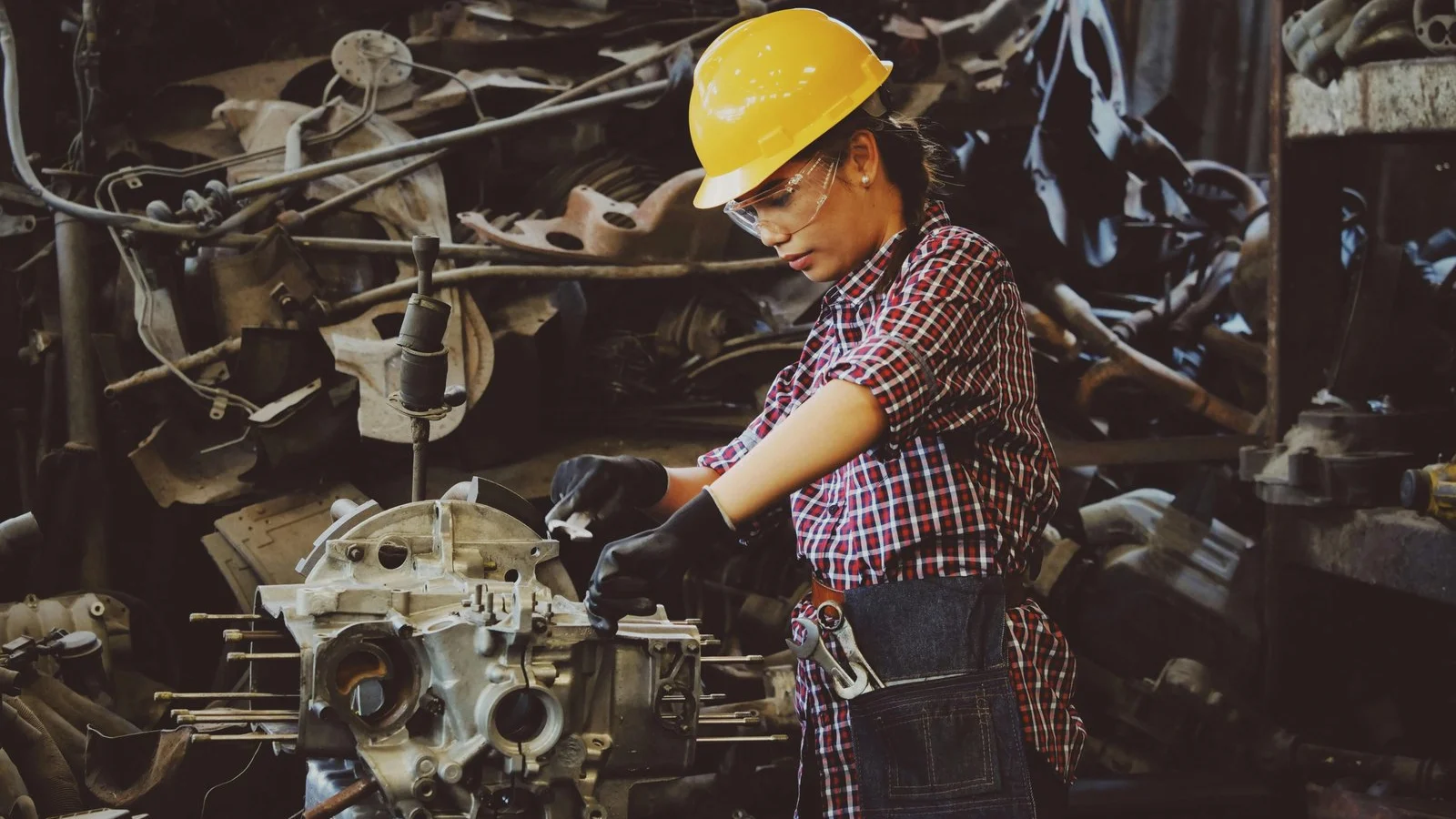 Machinist working on industrial equipment