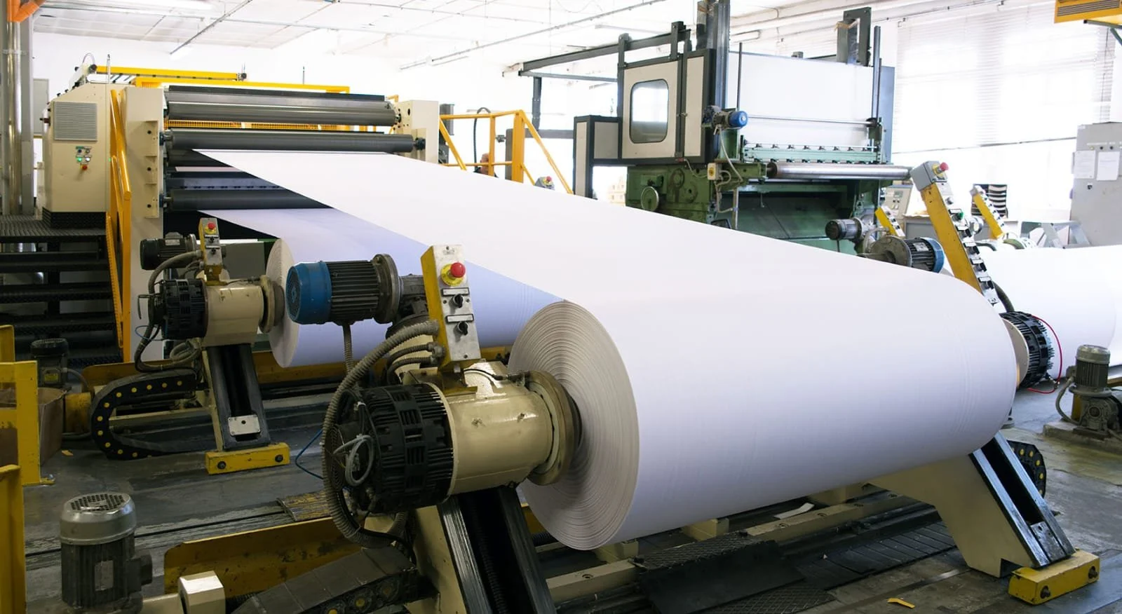 Paper machine producing paper rolls
